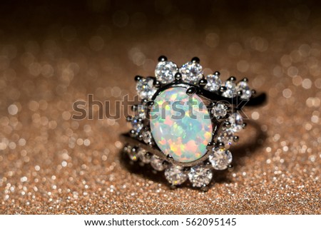 Fashion ring decorated with white fire opal stones.
