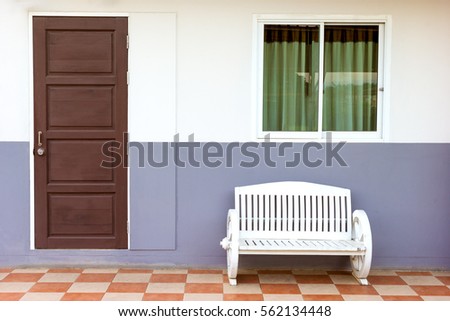 white bench with window and door