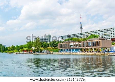 View of restaurants on the shore of donau river near VIC and Donauturm in Vienna, Austria.