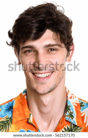 Face of young happy handsome man smiling wearing Hawaiian shirt
