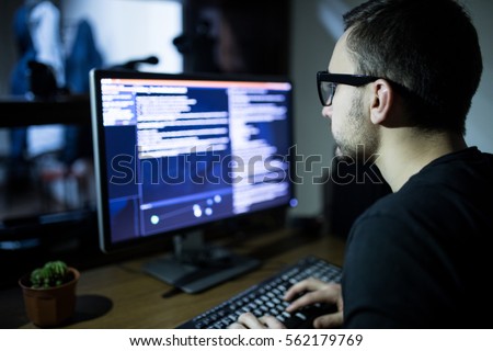 Hacker attack the server in the dark Royalty-Free Stock Photo #562179769