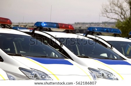 Police cars with red and blue color sirens 