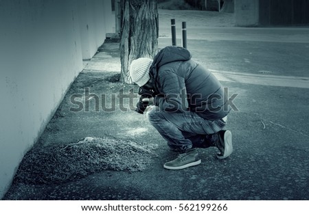 Man making photos on leaves street , profession