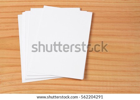 Blank portrait A4. brochure magazine isolated on wooden table, changeable background