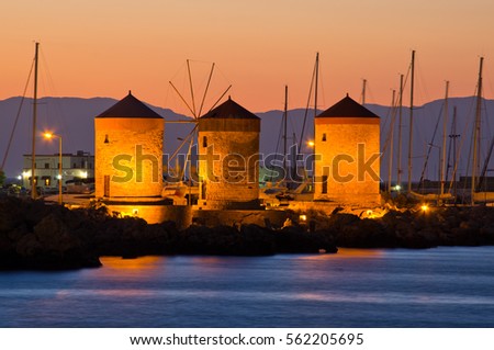 Windmills in the port of Rhodes - Greece Royalty-Free Stock Photo #562205695