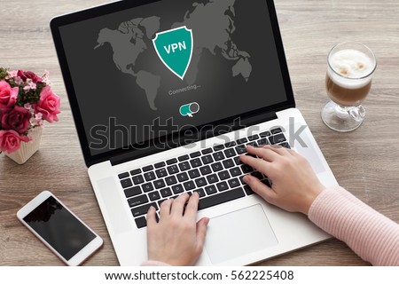 woman holding notebook with app vpn creation Internet protocols for protection private network Royalty-Free Stock Photo #562225408