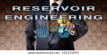 Corporate manager in blue business suit touching RESERVOIR ENGINEERING on an interactive virtual computer screen. Oil and gas industry technology concept for a special type of petroleum engineering.