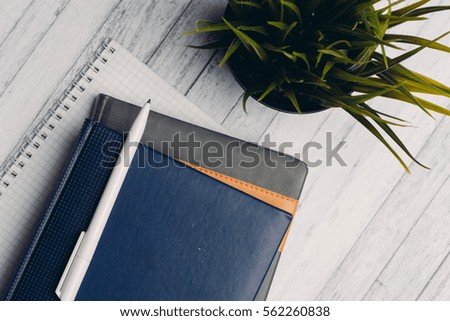  notebook pen on a table business