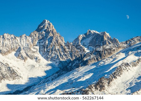 Mountains, the Alps. Moon over the mountain. Ski resort. Chamonix Mont Blanc,  Aiguille Du Midi, France.