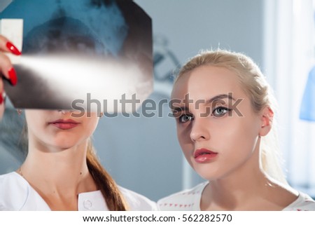 Doctor and patient looking an x-ray picture