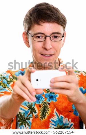 Face of happy man smiling while taking picture with mobile phone