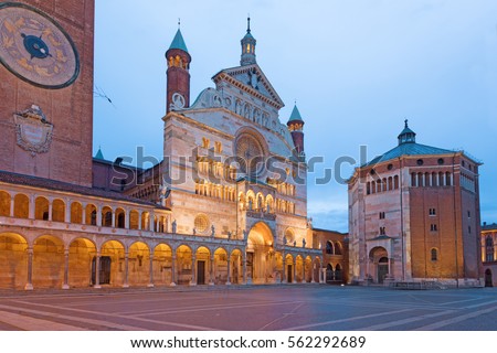 Cremona - The cathedral Assumption of the Blessed Virgin Mary and the Baptistery at dusk. Royalty-Free Stock Photo #562292689