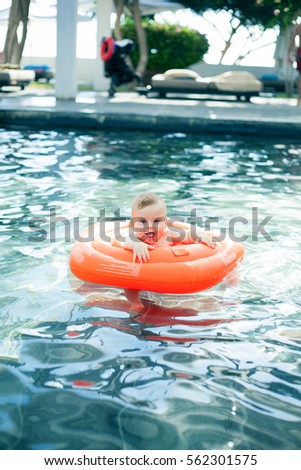 Happy child playing in swimming pool	