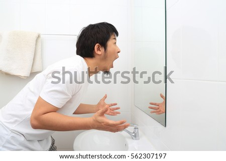 The Asian man in the bathroom.