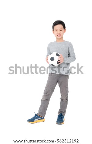 Young asian boy holding ball over white background
