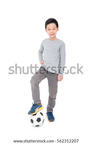 Young asian boy stand with ball over white background
