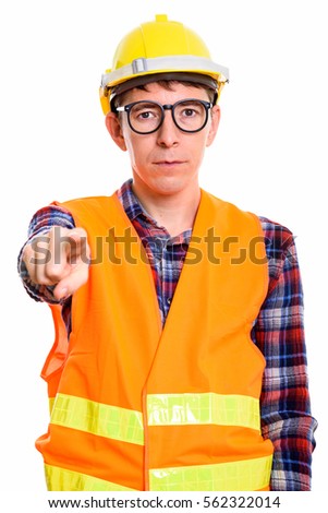 Studio shot of man construction worker pointing finger at camera