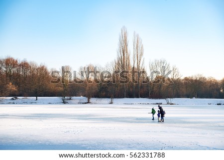 People on a frozen lake in winter
