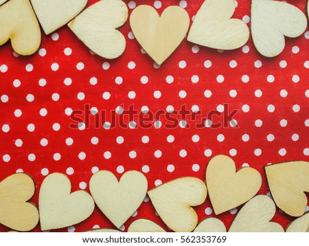 wooden hearts on the pieces of fabric. selective focus. 