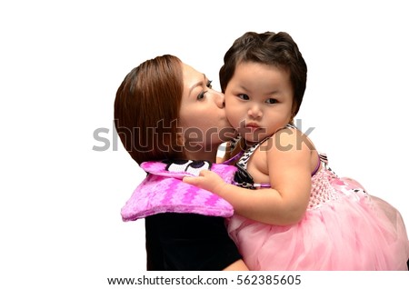 mother is kissing her adorable fat baby girl. memorable pictures. candid