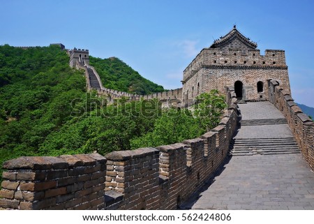 A beautiful green mountain and the watchtower of The Great Wall of China in summer at Mutianyu section nears Beijing, China. Royalty-Free Stock Photo #562424806