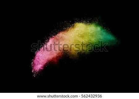 abstract powder splatted background. multicolor powder explosion on black background. Colored cloud. Colorful dust explode. Paint Holi.