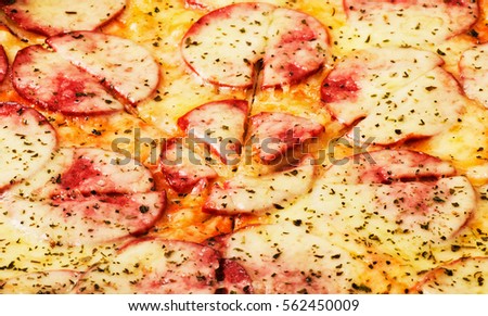 Pizza background close-up macro shot of pepperoni pizza