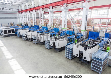 molding and cast press machine for the manufacture of plastic parts using polymers for  refrigerator Royalty-Free Stock Photo #562456300