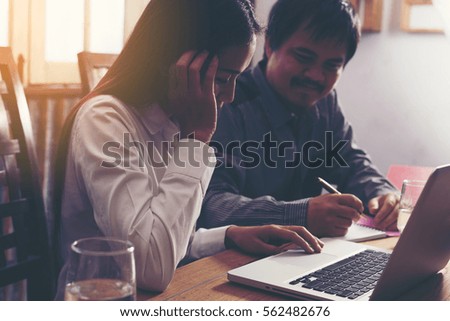 Business team taking notes on a meeting
