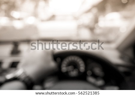 Picture blurred for background abstract and can be illustration to article of hands driving car steering wheel