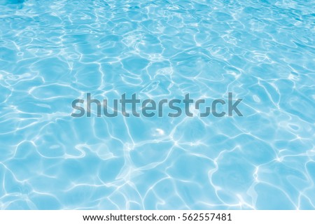 water in swimming pool rippled water detail background Royalty-Free Stock Photo #562557481