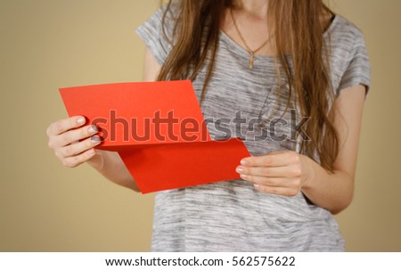 Girl reading blank red flyer brochure. Read detailed booklet. Leaflet presentation. Pamphlet hold hands. Woman show clear offset paper. Sheet template. Booklet design sheet display read first person