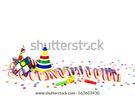 Streamers and party hats before white background