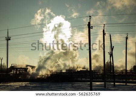 plant pipe with smoke against . picture against the sun