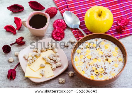 Ready breakfast. Muesli with milk, cheese, bran, apple and black coffee.