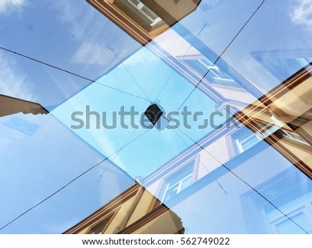 Double exposure of architecture makes weird buildings and form fantastic shapes like here seems as a diamond formed from walls and wires