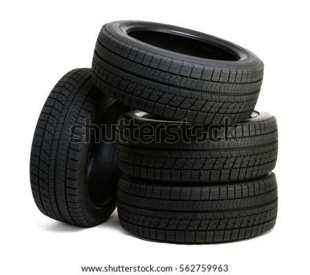 Car tires isolated on white Royalty-Free Stock Photo #562759963