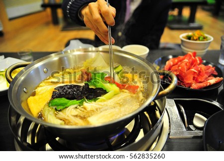 boiling  vegetables and meat soup
