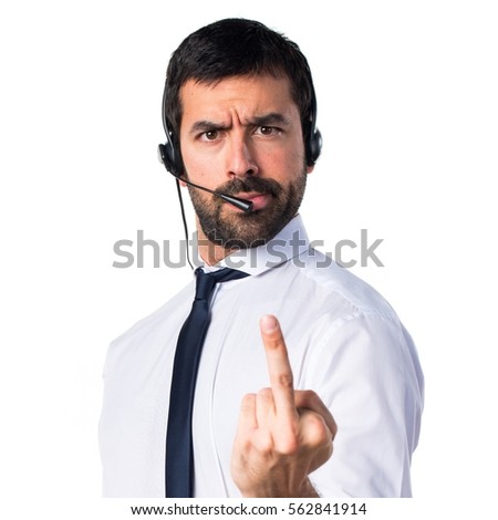 Young man with a headset making horn gesture