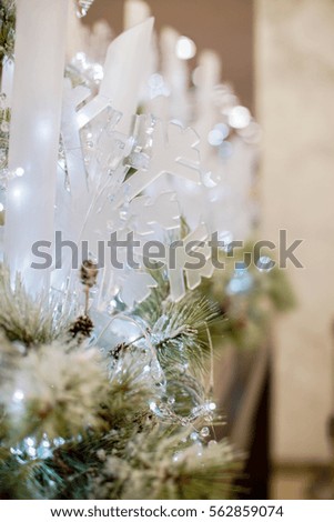 close up of Christmas pine cones, white lights and decorations