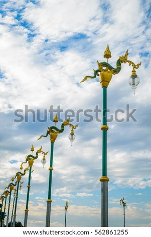 king of snake lamppost with cloud sky in Thailand, Asia.