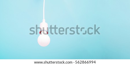 Energy saving LED light bulb on a blue background.