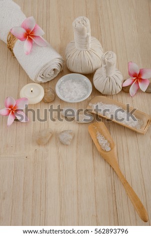 Beauty and fashion concept with spa set on wooden background