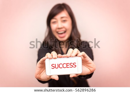 Happy confident businesswoman show her smartphone. concept for business and communication.
