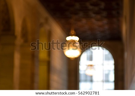 Chandelier and window in the hallway  in blurred picture style