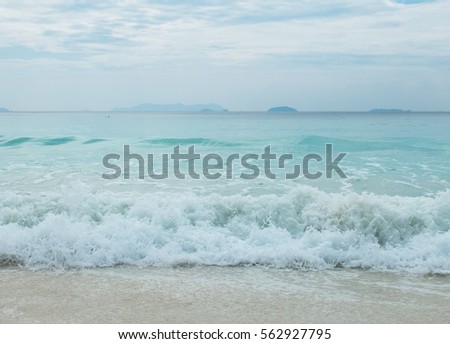 Splashing Waves from The Blue Sea  to The Clear White Sand Beach in Myanmar with Copyspace to input Text