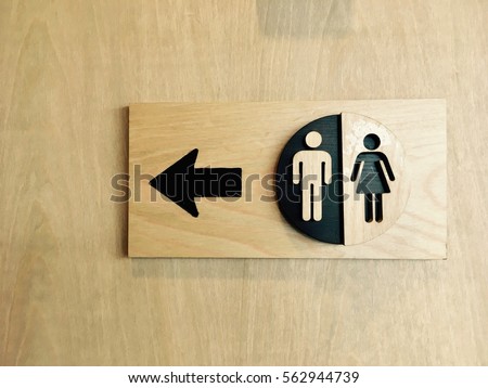 Toilets icon, Public restroom signs ,Toilet sign and direction on wooden background