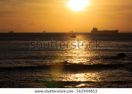 Woman's silhouette with sunset in the background 