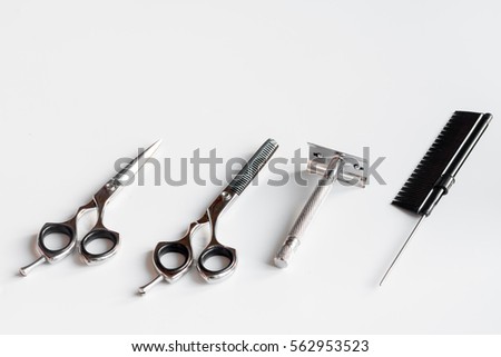 white desktop with tools for shaving beards