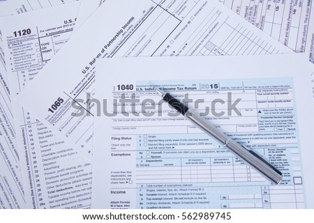 Pen on US TAX form  Background. 
 Tax Day concept Royalty-Free Stock Photo #562989745
